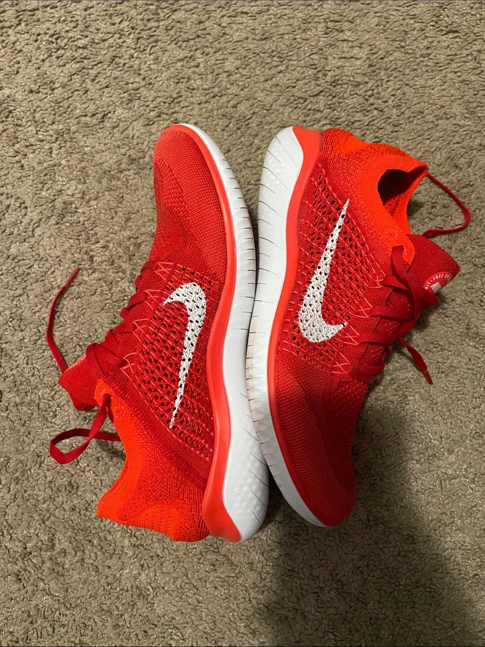 Nike Men’s Red Flyknit Sneakers with White Swoosh